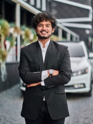 Free-Photo-_-Indian-businessman-with-his-white-car_